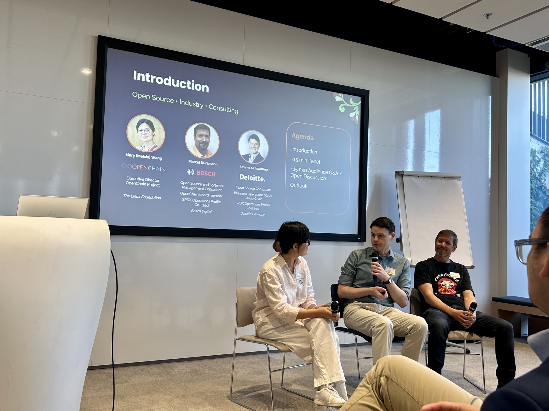 Mary (Meixia) Wang, Ummo Schwarting, and Marcel Kurzmann discussing operational compliance.